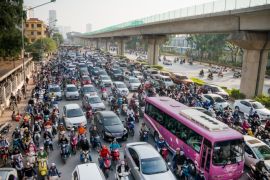 HANOI, VIETNAM - NOVEMBER 04: Morning traffic jam on Nguyen Trai Road, Thanh Xuan District on November 4, 2016 in Hanoi, Vietnam. Hanoi is ranked as one of the most polluted city in Southeast Asia with the air quality monitor installed by U.S. Embassy in the city center often shows Air Quality Index (AQI) of over 200 at day time, listed as â 'Very Unhealthy'. The main cause of this air pollution is over 5.3 million motorbikes and 560,000 cars in the traffic of Hanoi