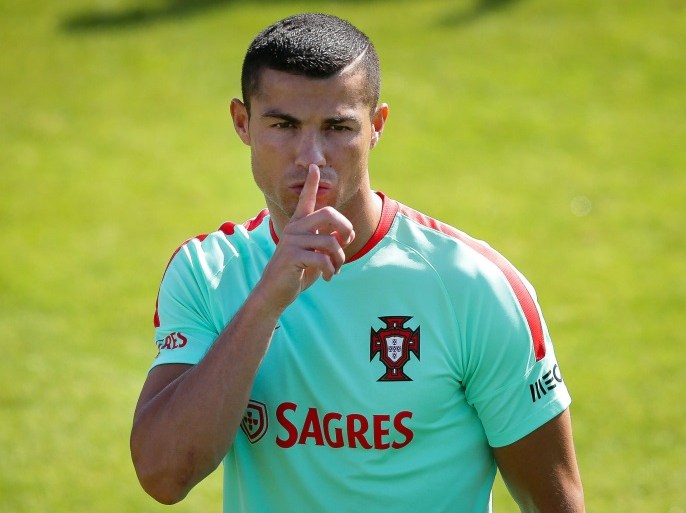 epa06027499 Portuguese national soccer team striker Cristiano Ronaldo gestures during his team's training session in Oeiras, near Lisbon, Portugal, 14 June 2017. Portugal will take part in the FIFA Confederations Cup 2017 taking place in Russia from 17 June until 02 July 2017. The Spanish General Attorney announced on 13 June 2017 a formal complaint against Cristiano Ronaldo accusing him of 'consciously' creating a corporate structure for a tax fraud of 14.7 million euros, media reports claimed. EPA/ANDRE KOSTERS