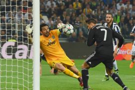 TURIN, ENGLAND - MAY 05: Cristiano Ronaldo of Real Madrid CF heads the ball past goalkeeper Gianluigi Buffon of Juventus to score their first and equalising goal during the UEFA Champions League semi final first leg match between Juventus and Real Madrid CF at Juventus Arena on May 5, 2015 in Turin, Italy. (Photo by Michael Regan/Getty Images)