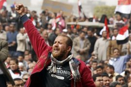 A man holds up his fist during a pro-democracy rally at Tahrir Square, in Cairo February 25, 2011. Egypt's new military rulers, promising to guard against