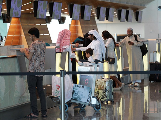 Passengers stand at Hamad International Airport in Doha, Qatar, June 7, 2017. REUTERS/Naseem Zeitoon