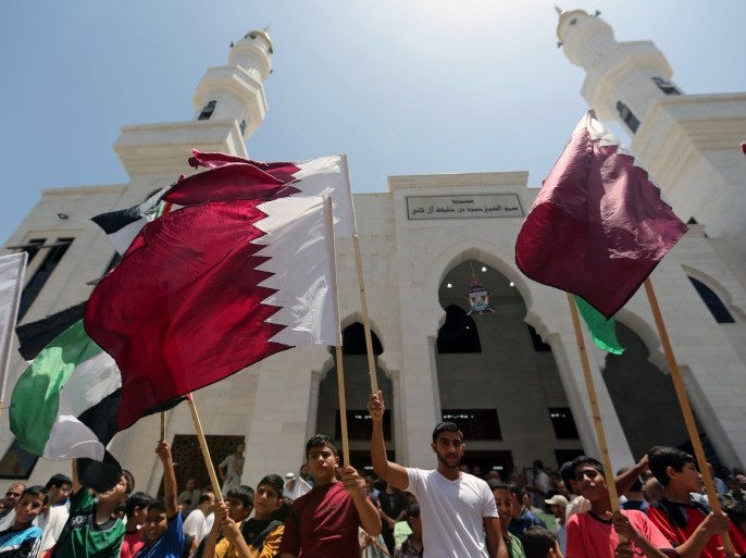Palestinians take part in a rally in support of Qatar, inside Qatari-funded construction project 'Hamad City', in the southern Gaza Strip, June 9, 2017. REUTERS/Ibraheem Abu Mustafa