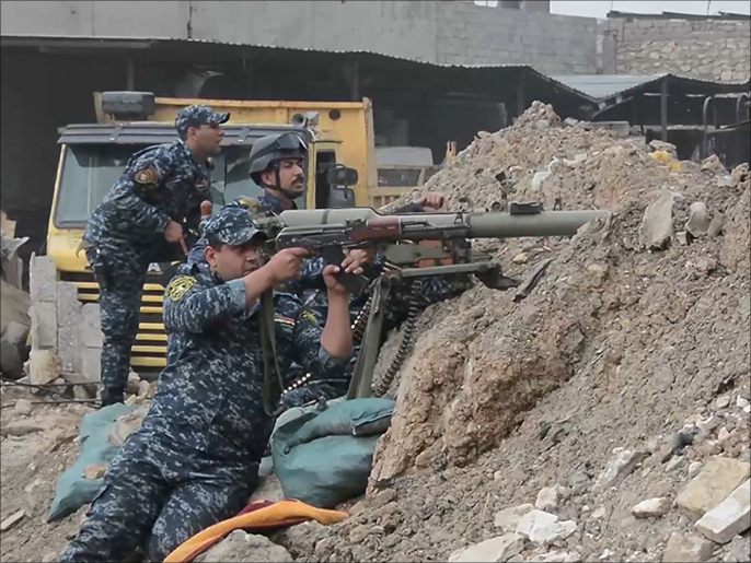 ‪عناصر من القوات العراقية بمنطقة الموصل القديمة‬ عناصر من القوات العراقية بمنطقة الموصل القديمة (الجزيرة)