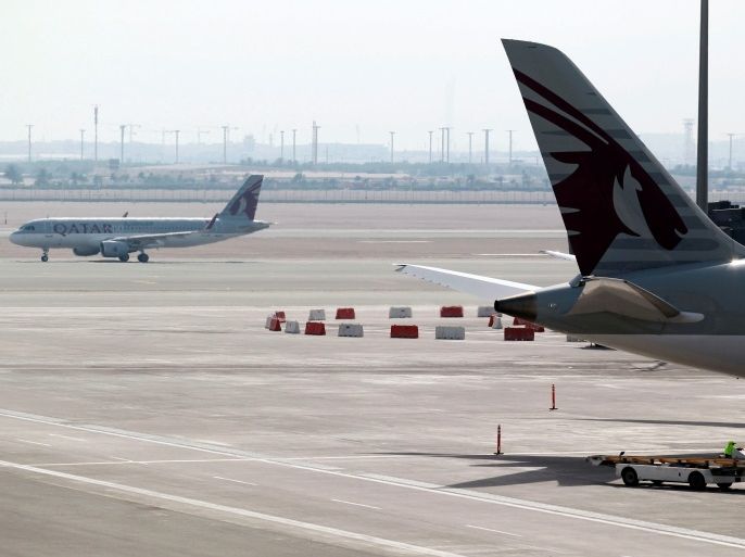 Qatar Airways aircrafts are seen at Hamad International Airport in Doha, Qatar, June 7, 2017. REUTERS/Naseem Zeitoon
