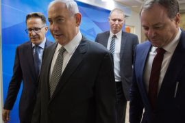 Israeli Prime Minister Benjamin Netanyahu (C) arrives to a weekly cabinet meeting at his office in Jerusalem June 11, 2017. REUTERS/Ariel Schalit/Pool