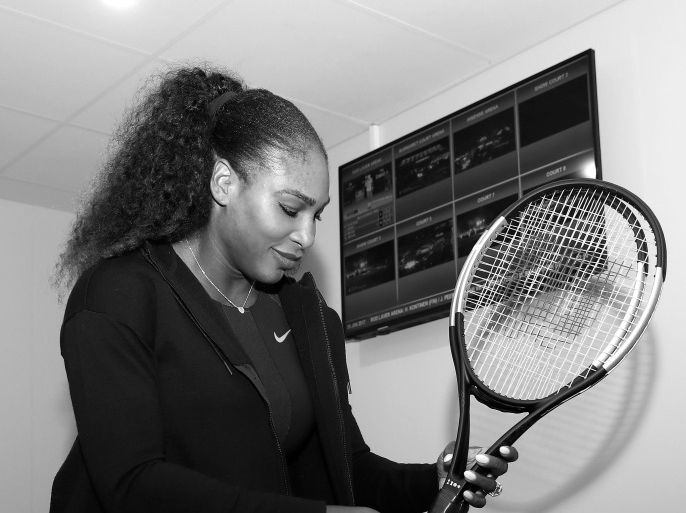 MELBOURNE, AUSTRALIA - JANUARY 28: (EDITORS NOTE: Image has been converted to black and white.) Serena Williams of the United States is presented with a special 23 Grand Slam Tennis Racket after winning the 2017 Women's Singles Final at Melbourne Park on January 28, 2017 in Melbourne, Australia. (Photo by Clive Brunskill/Getty Images for Wilson)