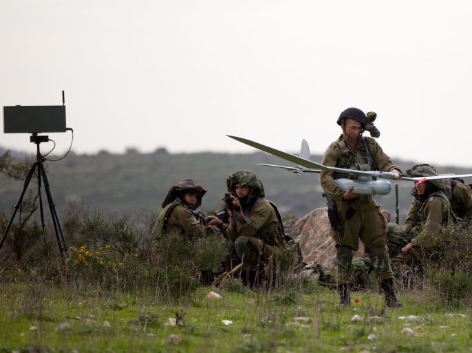 BAT SHLOMO, ISRAEL - JANUARY 16: (ISRAEL OUT) Israeli soldiers get ready to launch the Skylark drone during a drill on January 16, 2012 near Bat Shlomo, Israel. The Skylark can carry a camera payload of up to 1kg, has an operational calking of 15,000ft and allows users to monitor any designated point within a 15km radius. The Skylark unit consists of a ground control element and three drones, which provide battalion-level commanders with real-time information. (Photo by Uriel Sinai/Getty Images)