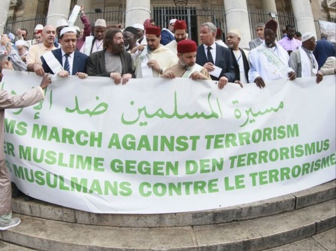 epa06078874 Participants of the 'Muslim March Against Terrorism' demonstration pose with a banner as they pay tribute to the victims of terrorism at Brussels Bourse place, in Brussels, Belgium, 10 July 2017. A group of about 30 Muslims and Imams took part in the initiative originally started by French Imam Chalghoumi and Jewish writer Marek Halter. The group tours Europe and visits the sites of recent Islamist terror attacks with Berlin, Brussels and Paris being the main points of their tour. EPA/OLIVIER HOSLET