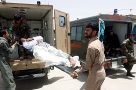 Afghan military medical personnel take an injured member of the Afghan security forces off an ambulance, prior to air transport for treatment in Kabul, at the Kandahar military Airport, Afghanistan July 9, 2017. Picture taken on July 9, 2017. REUTERS/Omar Sobhani