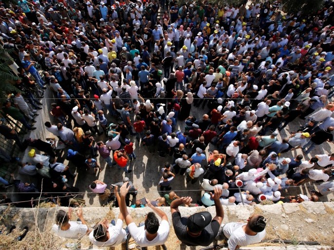 Palestinians gather inside Jerusalem's Old city outside the compound known to Muslims as Noble Sanctuary and to Jews as Temple Mount, after Israel removed all security measures it had installed at the compound July 27, 2017. REUTERS/Amir Cohen