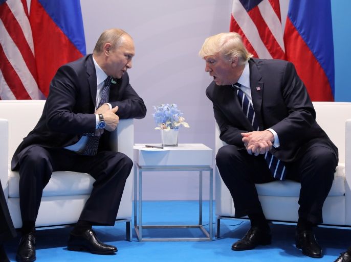 U.S. President Donald Trump speaks with Russian President Vladimir Putin during the their bilateral meeting at the G20 summit in Hamburg, Germany July 7, 2017. REUTERS/Carlos Barria