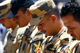 Egyptian army officers react during the funeral of officer Khaled al-Maghrabi, who was killed during a suicide bomb attack on an army checkpoint in Sinai, in his hometown Toukh, Al Qalyubia Governorate, north of Cairo, Egypt 8 July, 2017. REUTERS/Mohamed Abd El Ghany