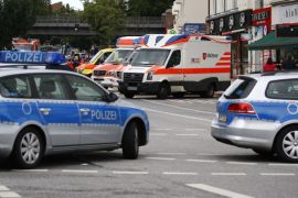 Security forces and ambulances are seen after a knife attack in a supermarket in Hamburg, Germany, July 28, 2017. REUTERS/Morris Mac Matzen