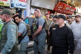 epa06078180 A handout photo made available by Iraqi prime minister office shows Iraqi Prime Minister Haider al-Abadi (R) visiting a market in western Mosul, Iraq, 09 July 2017. Abadi arrived on 09 July to the Iraqi 'Liberated' city of Mosul and congratulated the Iraqi Forces and its civilian population after reportedly defeating Islamic State Jihadists. EPA/IRAQI PRIME MINISTER OFFICE HAND HANDOUT EDITORIAL USE ONLY/NO SALES
