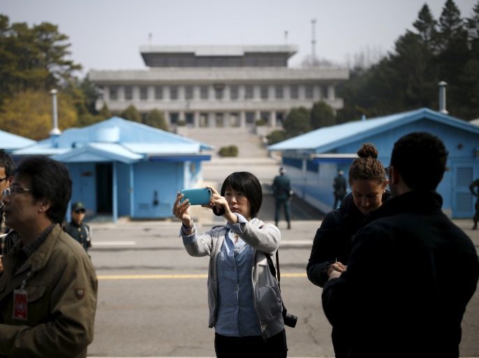 A foreign tourist takes a selfie at the truce village of Panmunjom, South Korea, March 30, 2016. REUTERS/Kim Hong-Ji