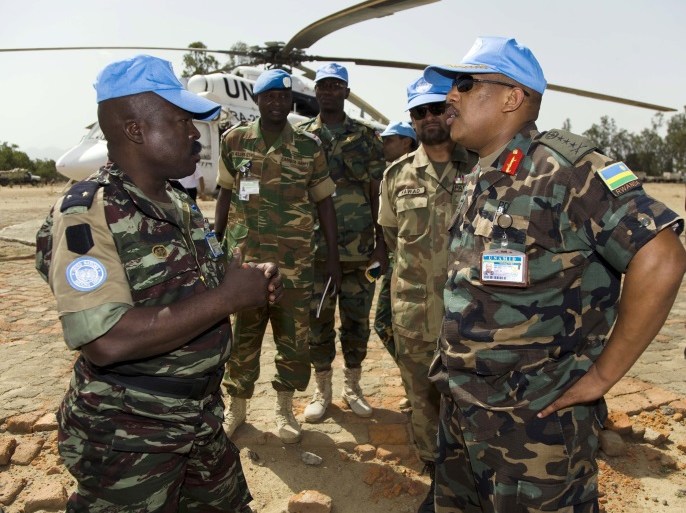 UNAMID Force Commander, Lieutenant General Patrick Nyamvumba (R), speaks to a UN soldier during his visit at the Nertiti UNAMID Camp Site, West Darfur.