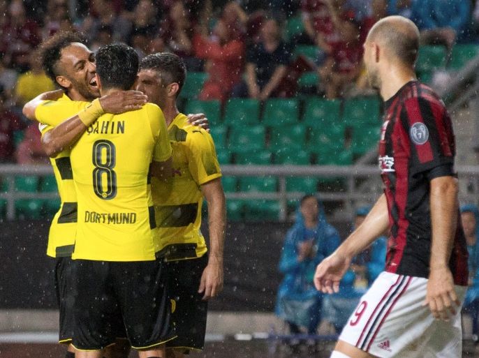 Soccer Football - AC Milan v Borussia Dortmund - International Champions Cup China - Guangzhou, Guangdong, China - July 18, 2017 - Borussia Dortmund's Pierre-Emerick Aubameyang celebrates a goal with his team mates. REUTERS/Stringer ATTENTION EDITORS - THIS IMAGE WAS PROVIDED BY A THIRD PARTY. CHINA OUT. NO COMMERCIAL OR EDITORIAL SALES IN CHINA.
