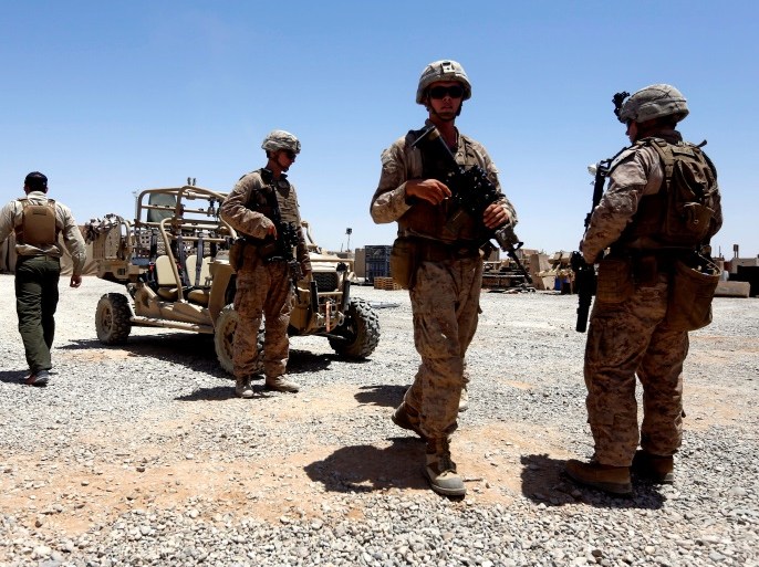U.S. Marines walk inside their base after they are back from training with Afghan National Army (ANA) soldiers in Helmand province, Afghanistan July 6, 2017. REUTERS/ Omar Sobhani