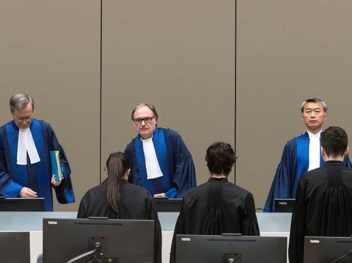 Judge Cuno Tarfusser (C), judge Chang-ho Chung (R) and judge Marc Perrin de Brichambautat (L) issue a ruling on South Africa's failure to arrest Sudanese President Omar al-Bashir during a three-day visit in June 2015, during a session of the International Criminal Court in The Hague, Netherlands, July 6, 2017. REUTERS/Evert Elzinga/Pool