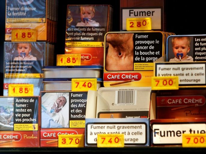 Packs of small cigars are displayed for sale by a tobacconist with health warnings as part of anti-smoking legislation in a French 'Tabac' in Paris, France, January 2, 2017. REUTERS/Charles Platiau