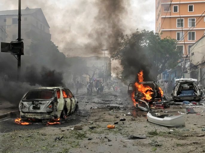 Vehicles burn at the scene of an explosion in Mogadishu, Somalia, July 30, 2017. REUTERS/Feisal Omar