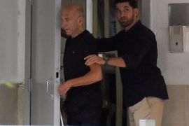 Former Israeli Prime Minister Ehud Olmert walks out of the prison door as he is released from prison after a parole board decided to cut his sentence by a third, at Maasiyahu prison near Ramle, Israel July 2, 2017. Walla!news/Rubi Kastro via REUTERS ISRAEL OUT. NO COMMERCIAL OR EDITORIAL SALES IN ISRAEL