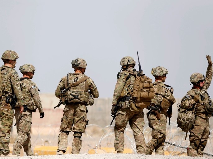 U.S. troops walk outside their base in Uruzgan province, Afghanistan July 7, 2017. REUTERS/Omar Sobhani TPX IMAGES OF THE DAY