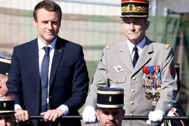 French President Emmanuel Macron (L) and Chief of the Defence Staff French Army General Pierre de Villiers (R) attend the traditional Bastille Day military parade on the Champs-Elysees in Paris, France, July 14, 2017. Picture taken July 14, 2017. REUTERS/Charles Platiau