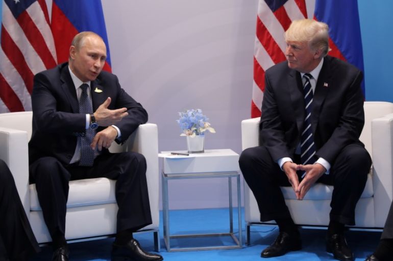 Russia's President Vladimir Putin talks to U.S. President Donald Trump during their bilateral meeting at the G20 summit in Hamburg, Germany July 7, 2017. REUTERS/Carlos Barria