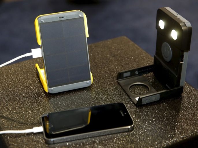 The WakaWaka Power+ compact solar charger and WakaWaka Light flashlight are displayed during the 2016 CES trade show in Las Vegas, Nevada January 8, 2016. Once the internal battery is charged, the $79.00 device charges a smartphone in less than 2 hours. The company also donates a solar-powered flashlight to someone without access to electricity for every unit sold, a representative said. REUTERS/Steve Marcus
