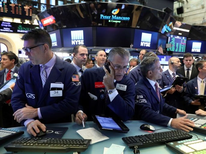 Traders work on the floor of the New York Stock Exchange (NYSE) in New York, U.S., July 19, 2017. REUTERS/Brendan McDermid