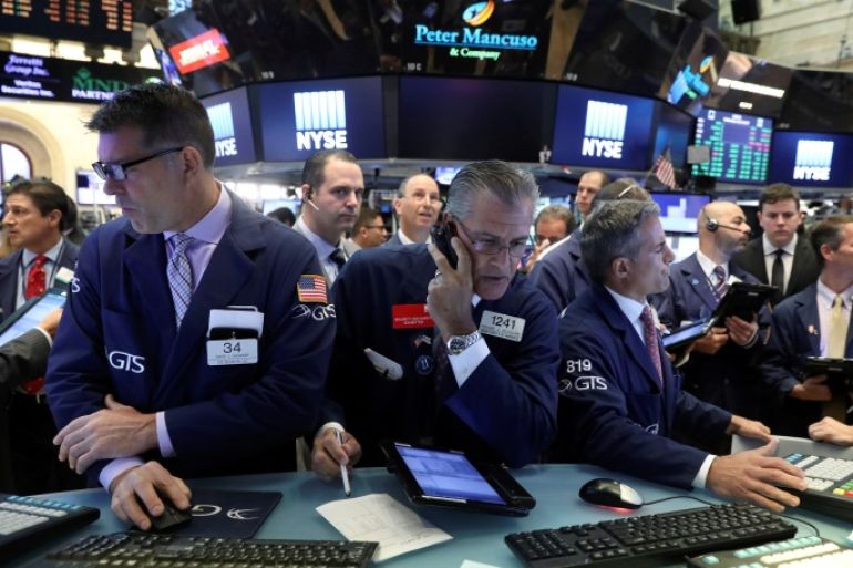 Traders work on the floor of the New York Stock Exchange (NYSE) in New York, U.S., July 19, 2017. REUTERS/Brendan McDermid