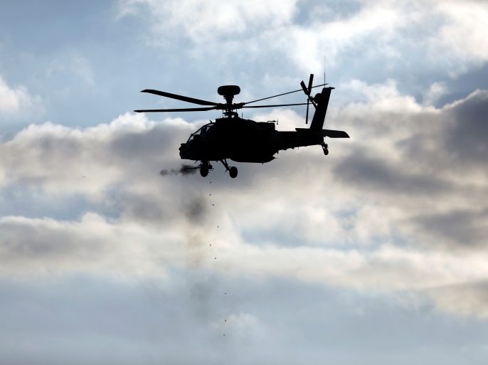 An Israeli Apache helicopter fires at a target during an aerial demonstration at a graduation ceremony for Israeli airforce pilots at the Hatzerim air base in southern Israel December 29, 2016. REUTERS/Amir Cohen
