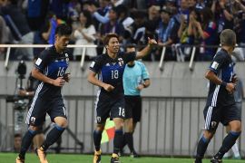 Japan's forward Takuma Asano (C) celebrates his goal during the group B World Cup 2018 qualifying football match between Japan and Australia in Saitama on August 31, 2017. / AFP PHOTO / Toru YAMANAKA (Photo credit should read TORU YAMANAKA/AFP/Getty Images)