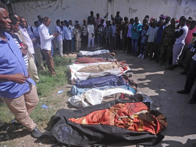 Relatives gather to look at the dead bodies of ten people including children after a raid on their farms in Bariire, some 50 km west of Mogadishu, on August 25, 2017.Somali officials said Friday they had killed eight jihadist fighters during an overnight operation, denying claims from local elders that they had shot civilians dead, two of them children. Somali community leaders accused the troops, accompanied by US military advisors, of having killed the nine civilians in the overnight operations. An initial government statement said its troops had come under fire from jihadists while on patrol, insisting that no civilians had been killed. A later statement acknowledged that there had been civilian casualties, in what the government seemed to suggest was a separate incident. They did not say who was responsible. / AFP PHOTO / Mohamed ABDIWAHAB (Photo credit should read MOHAMED ABDIWAHAB/AFP/Getty Images)