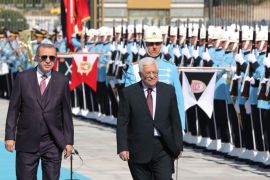Palestinian President Mahmud Abbas (R) and Turkish President Recep Tayyip Erdogan (L) review an honour guard during an official welcoming ceremony at the Presidential Complex in Ankara on August 28, 2017. / AFP PHOTO / ADEM ALTAN (Photo credit should read ADEM ALTAN/AFP/Getty Images)