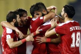 Football Soccer - China v Syria - World Cup Group A Qualifier - Hang Jebat Stadium, Malacca City, Malaysia - 13/06/17 - Syria's Ahmad Alsaleh celebrates with teammates after scoring an equalizer against China REUTERS/Lai Seng Sin