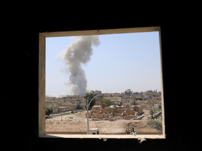 Smoke rises after an air strike during the fighting between the Syrian Democratic Forces and Islamic State in the old city of Raqqa, Syria August 9, 2017. REUTERS/Zohra Bensemra
