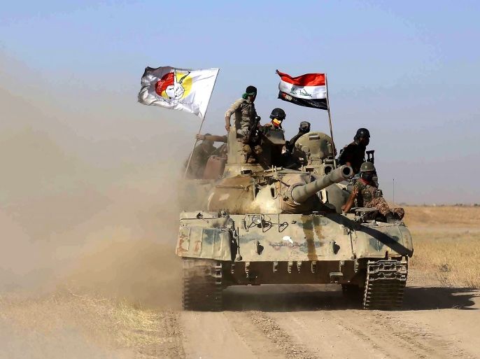 Iraqi government forces supported by fighters from the Abbas Brigade, which fights under the umbrella of the Shiite popular mobilisation units, advance towards the city of Tal Afar, the main remaining stronghold of the Islamic State group, after the government announced the beginning of an operation to retake it from the jihadists, on August 20, 2017.Iraqi forces pounded the Islamic State group in Tal Afar in a new assault just weeks after ousting IS from second city Mo