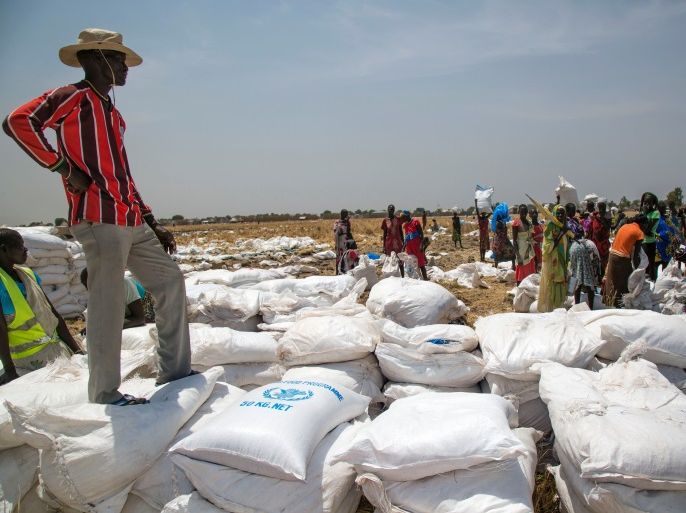 A community leader supervises a food distribution fon March 4, 2017, in Ganyiel, Panyijiar county, Unity state, in South Sudan.South Sudan was declared the site of the world's first famine in six years, affecting about 100,000 people. More than three years of conflict have disrupted farming, destroyed food stores and forced people to flee recurring attacks. Food shipments have been deliberately blocked and aid workers have been targeted. / AFP PHOTO / Albert Gonzalez Farran - AFP / Albert Gonzalez Farran (Photo credit should read ALBERT GONZALEZ FARRAN/AFP/Getty Images)