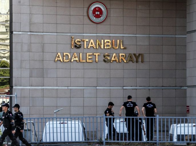 ISTANBUL, TURKEY - JULY 24: Turkish police officers stand guarded outside the central Istanbul court during a protest against the trial of journalists and staff from Cumhuriyet newspaper on July 24, 2017, in Istanbul Turkey. Seventeen journalists and managers at Turkish opposition newspaper Cumhuriyet are facing trial on charges of aiding a terrorist organization and Turkish prosecutors are seeking up to 43 years in jail for staff from the paper, including some of Turkey's best-known journalists. Turkey is currently listed as the country with the biggest number of imprisoned journalists. Journalism organizations say more than 150 journalists are behind bars, most of them accused of terror charges and 150 media outlets have been shut down after the last year's failed coup. (Photo by Burak Kara/Getty Images)