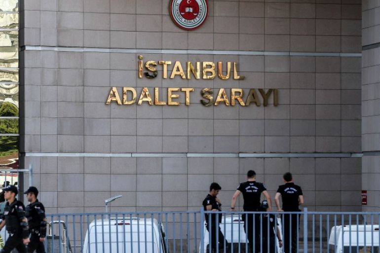 ISTANBUL, TURKEY - JULY 24: Turkish police officers stand guarded outside the central Istanbul court during a protest against the trial of journalists and staff from Cumhuriyet newspaper on July 24, 2017, in Istanbul Turkey. Seventeen journalists and managers at Turkish opposition newspaper Cumhuriyet are facing trial on charges of aiding a terrorist organization and Turkish prosecutors are seeking up to 43 years in jail for staff from the paper, including some of Turkey's best-known journalists. Turkey is currently listed as the country with the biggest number of imprisoned journalists. Journalism organizations say more than 150 journalists are behind bars, most of them accused of terror charges and 150 media outlets have been shut down after the last year's failed coup. (Photo by Burak Kara/Getty Images)