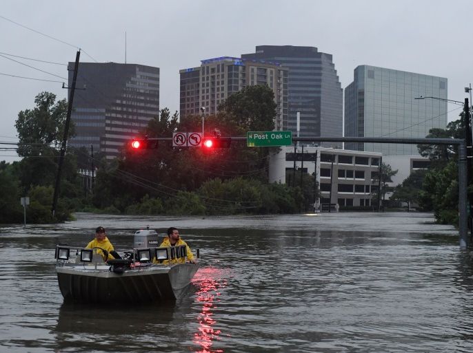 Rescue crews search for people in distress after Hurricane Harvey caused heavy flooding in Houston, Texas on August 27, 2017. Massive flooding unleashed by deadly monster storm Harvey left Houston -- the fourth-largest city in the United States -- increasingly isolated as its airports and highways shut down and residents fled homes waist-deep in water. / AFP PHOTO / MARK RALSTON (Photo credit should read MARK RALSTON/AFP/Getty Images)