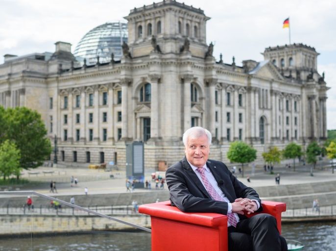 Minister President of Bavaria and leader of Bavarian CDU's sister Party CSU, Horst Seehofer, sits in a red chair on the terrace of the Marie Elisabeth Lueders House on August 20, 2017 in Berlin. / AFP PHOTO / dpa / Gregor Fischer / Germany OUT (Photo credit should read GREGOR FISCHER/AFP/Getty Images)