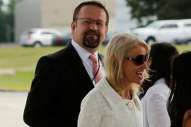 White House adviser Sebastian Gorka (L), standing with White House counselor Kellyanne Conway (C), waits for U.S. President Donald Trump to arrive to board Air Force One for travel to Ohio from Joint Base Andrews, Maryland, U.S. July 25, 2017. Picture taken July 25, 2017. REUTERS/Jonathan Ernst