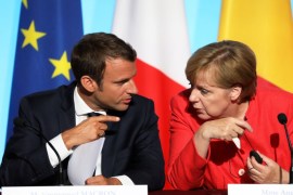French President Emmanuel Macron (L) and German Chancellor Angela Merkel attend a meeting with EU and African leaders to discuss how to ease the European Union's migrant crisis, at the Elysee Palace in Paris, on August 28, 2017.Seven African and European leaders met in Paris on August 28 to try to build a 'new relationship' aimed at stemming the flow of migrants into Europe from northern Africa in return for aid. / AFP PHOTO / ludovic MARIN (Photo credit shoul