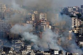 Smoke rises from buildings in Ain el-Helweh, Lebanon's largest Palestinian refugee camp, near the southern coastal city of Sidon, during clashes between Palestinian security forces and Islamist fighters on August 19, 2017. / AFP PHOTO / Mahmoud ZAYYAT (Photo credit should read MAHMOUD ZAYYAT/AFP/Getty Images)