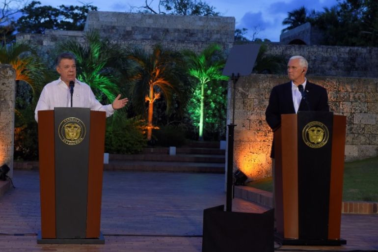 Colombia's President Juan Manuel Santos and U.S. Vice President Mike Pence during a press conference in Cartagena, Colombia August 13, 2017. Colombian Presidency/Handout via REUTERS ATTENTION EDITORS - THIS IMAGE HAS BEEN SUPPLIED BY A THIRD PARTY.