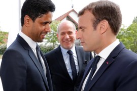 French President Emmanuel Macron talks with Paris St Germain's charmain and CEO Nasser Al-Khelaif during a visit at the recreational centre for children in Moisson, France, August 3, 2017. REUTERS/Philippe Wojazer