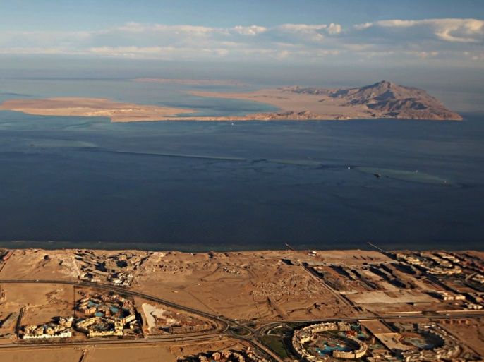 (FILE) A picture taken on January 14, 2014 through the window of an airplane shows the Red Sea's Tiran (foreground) and the Sanafir (background) islands in the Strait of Tiran between Egypt's Sinai Peninsula and Saudi Arabia.Saudi King Salman on April 11, 2016 wrapped up a landmark five-day visit to Egypt marked by lavish praise and multi-billion-dollar investment deals, in a clear sign of support for President Abdel Fattah al-Sisi's regime. Egypt also agreed during the visit to demarcate its maritime borders with Saudi by officially placing the two islands in the Straits of Tiran in Saudi territory. / AFP PHOTO / STRINGER (Photo credit should read STRINGER/AFP/Getty Images)